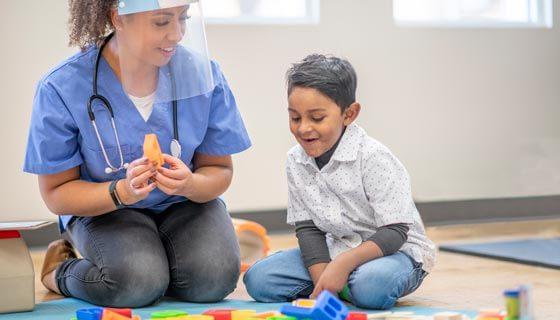 Occupational therapist with pediatric patient